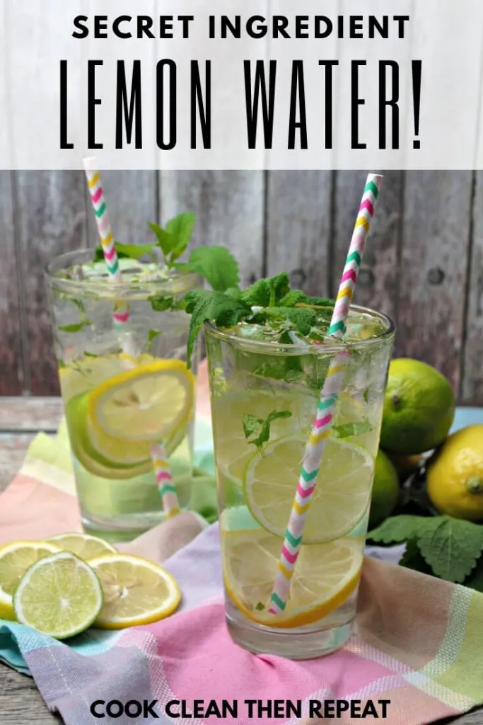 Secret Ingredient Lemon Water! At the top of photo of two glasses of water with lemon, leaves, limes, and paper straws.