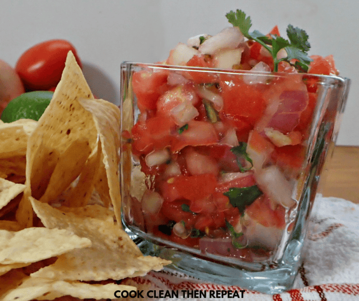pico in a square glass dish with chips next to it.