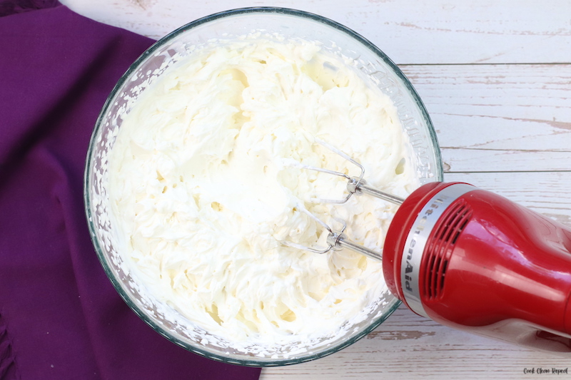 beating the whipped cream with a mixer