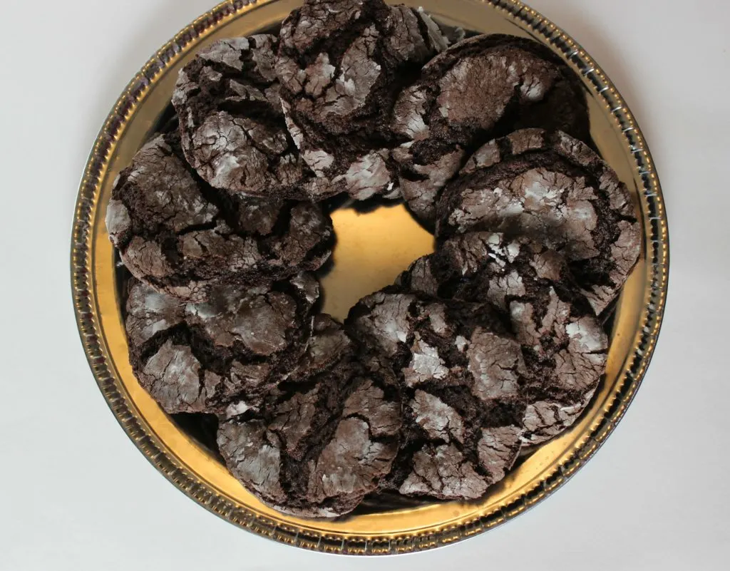You can make soft and chewy crinkle cookies with just four simple ingredients. Start with your favorite cake mix and from there it just gets easier. These are a great cookie to enjoy with a cold glass of milk. #cookies #cookierecipes #cakemixcookies 