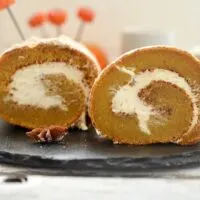 featured image showing the finished easy pumpkin roll recipe ready to eat.