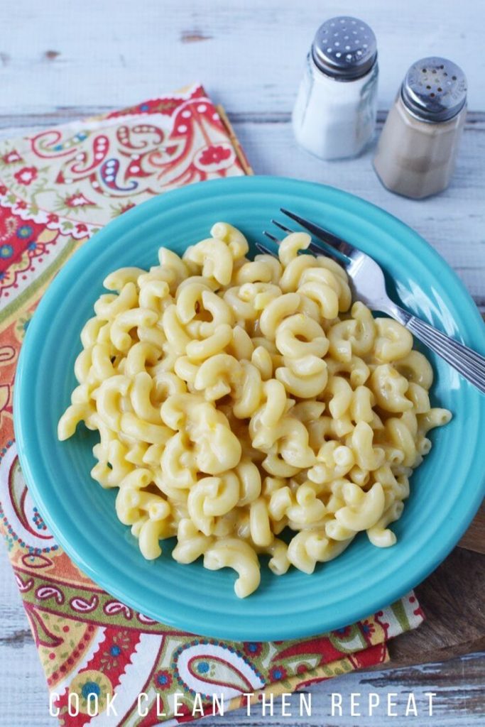 Tall image showing finished Mac and cheese on a plate ready to eat.