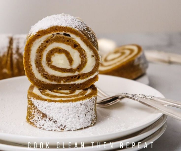 featured image of the pumpkin roll slices stacked on a plate to eat.