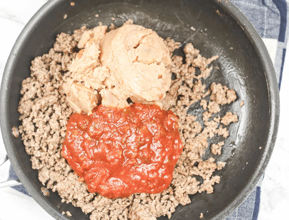 add refried beans and tomato sauce for taco bake recipe