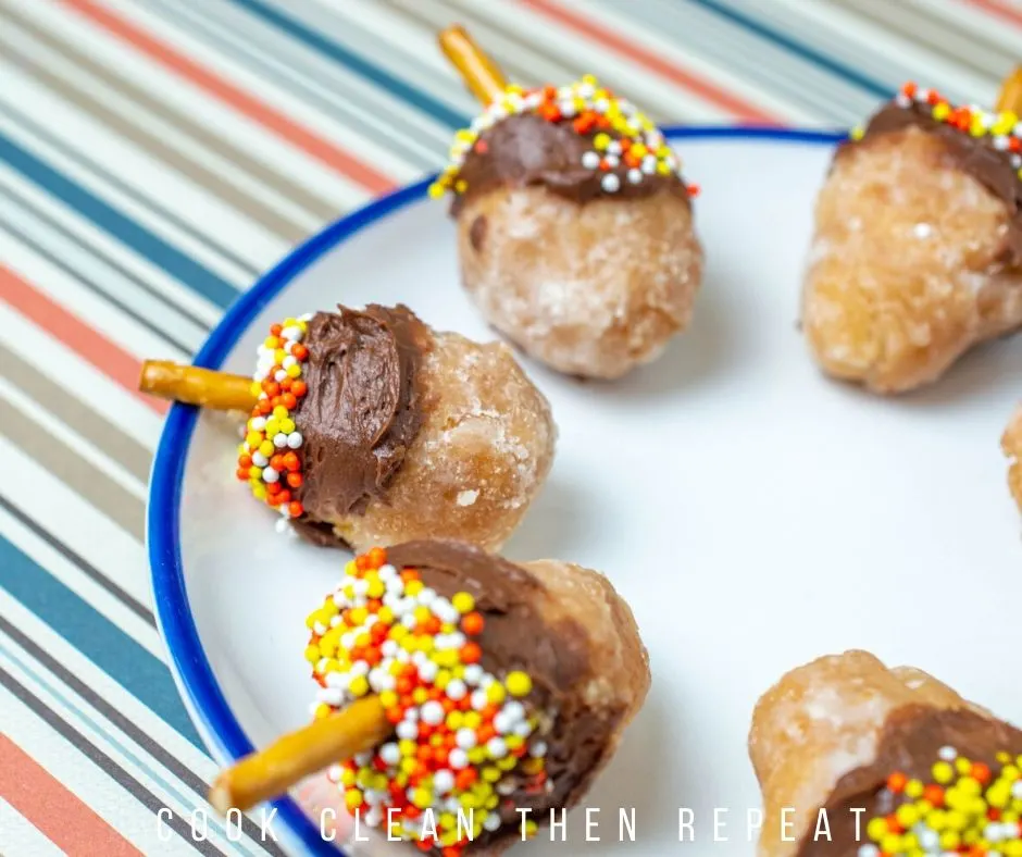 Finished donut holes on a plate.