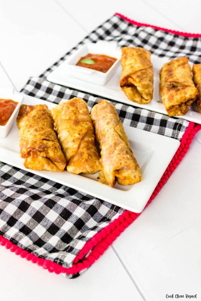 Finished egg rolls with pizza fillings. 
