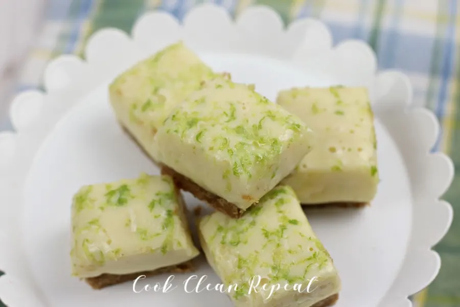 A bunch of key lime pie fudge stacked up on a white tray.