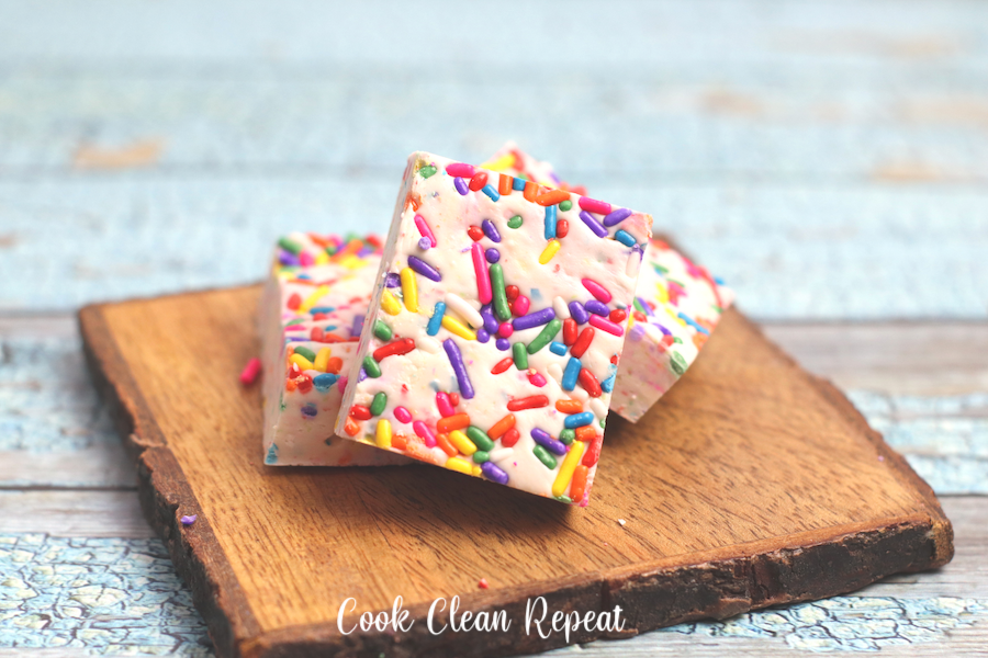 Another look at the completed unicorn dessert recipe with fudge on a block of wood ready to be served.