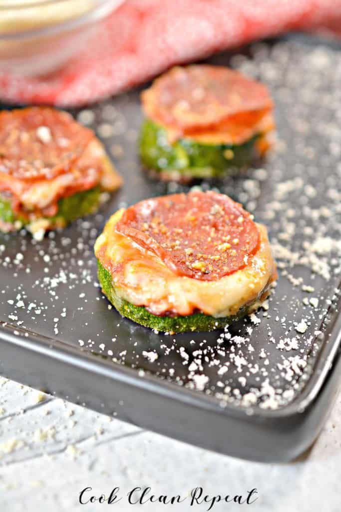 A shot of the finished zucchini pizza bites on a tray ready to eat.