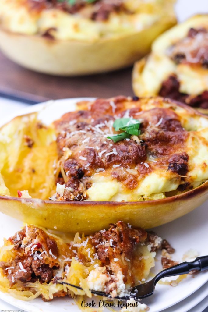 A top down view of the finished baked spaghetti squash lasagna boats. 