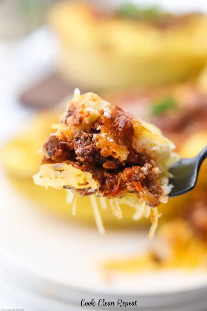 A close up look at a bite of the finished spaghetti squash lasagna recipe. 