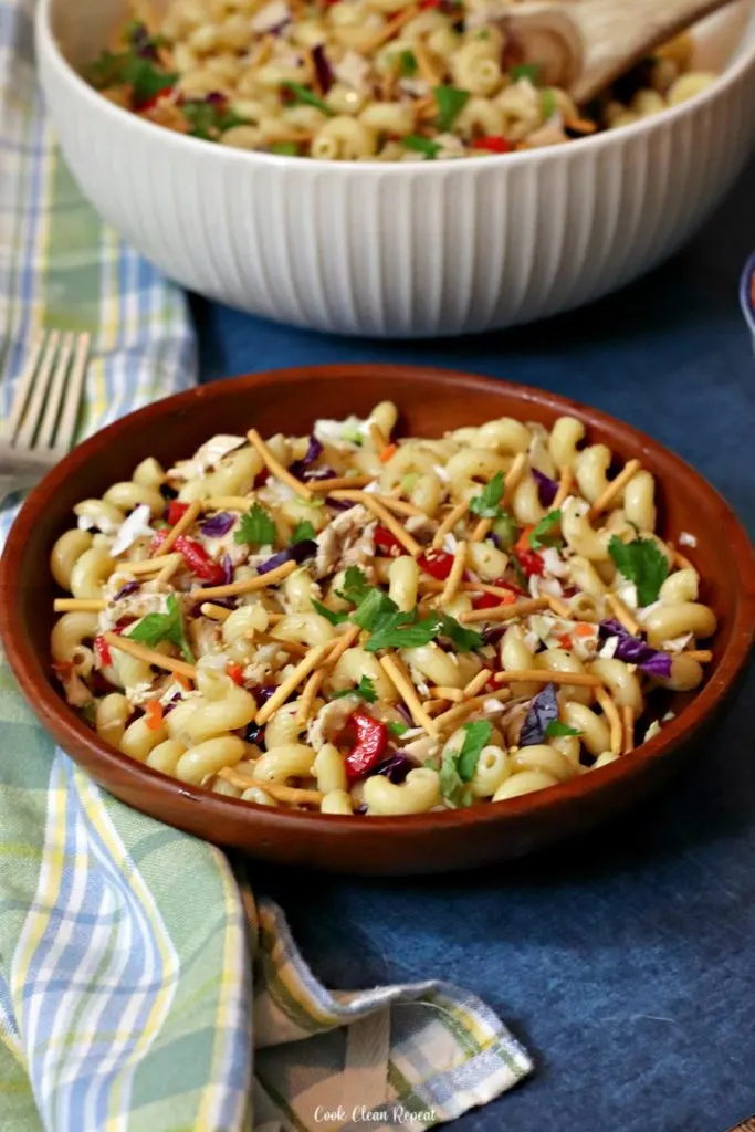 A full bowl of delicious pasta salad with chicken ready to be shared. 