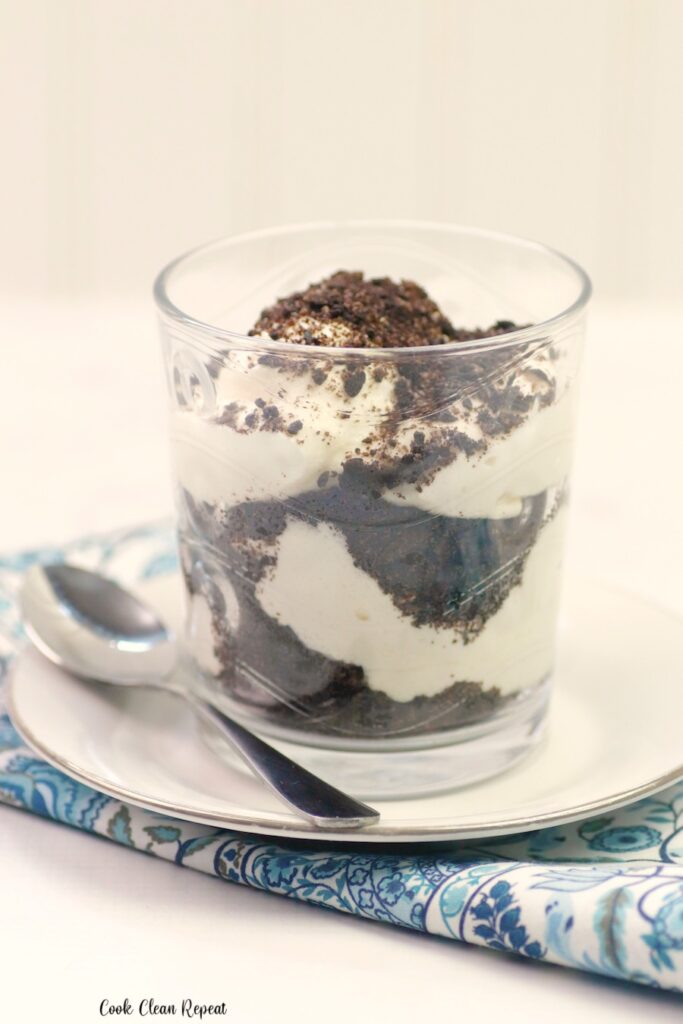 A close up shot of a finished cookies and cream parfait ready to eat. 