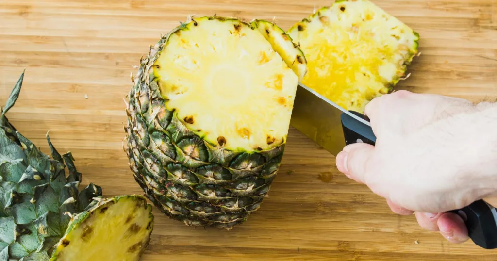 cutting a pineapple