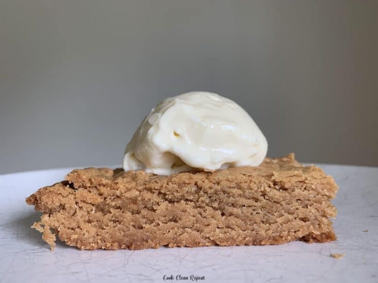 Featured image showing one of the finished peanut butter blondies ready to eat.