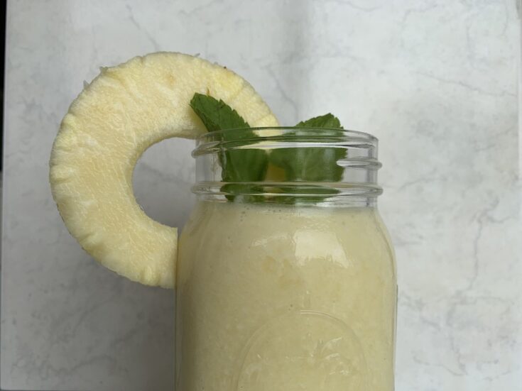 Featured image showing the finished pineapple smoothie ready to drink!