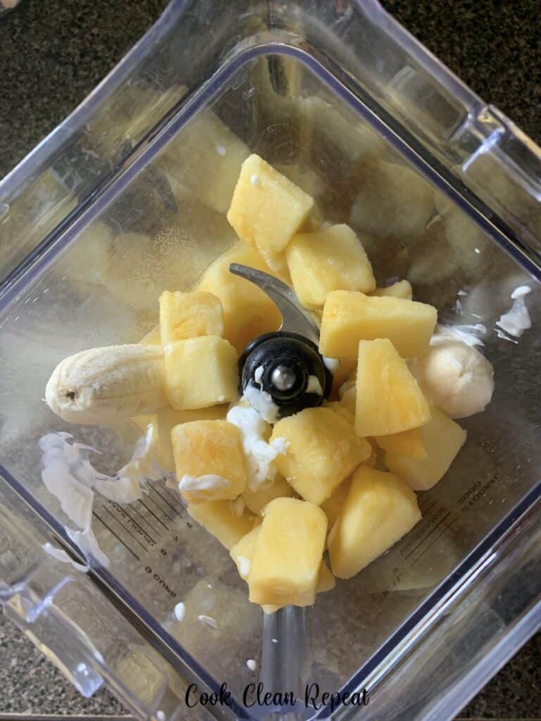 A look into the blender at the process of making a smoothie.