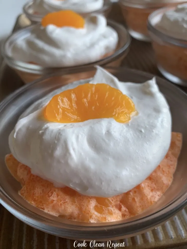 A close up view of the finished jello mousse in cups ready to eat. 