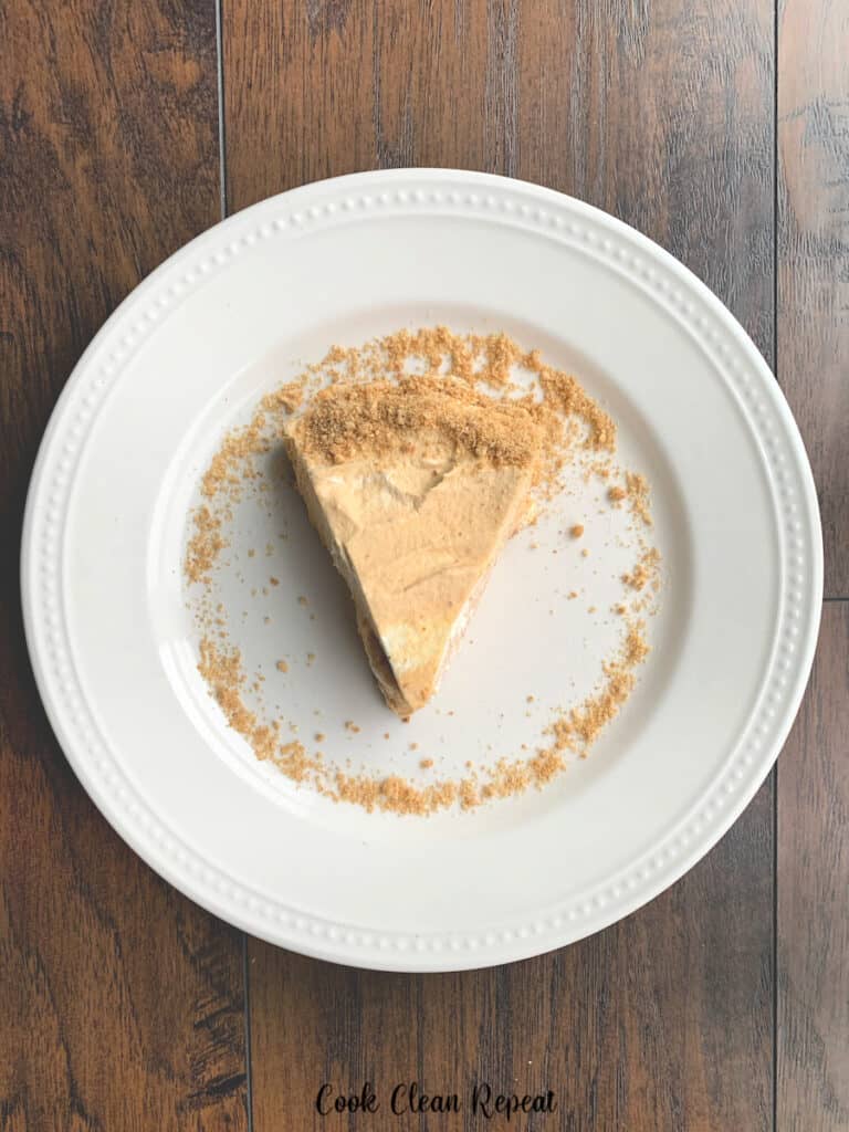 A top down view of a single slice of no bake pumpkin pie ready to eat.