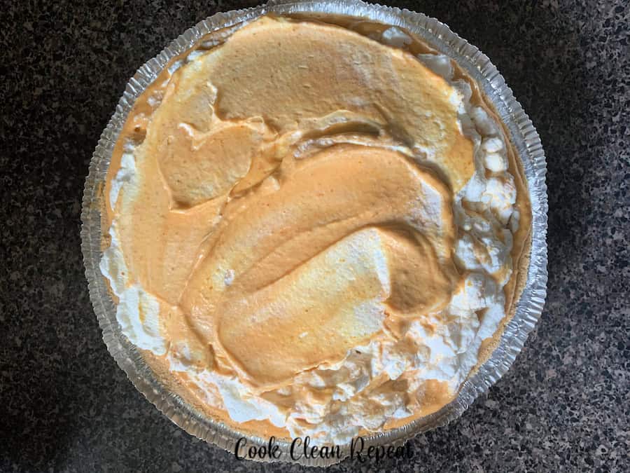 A top down look at the full finished no bake pumpkin pie ready to be sliced.