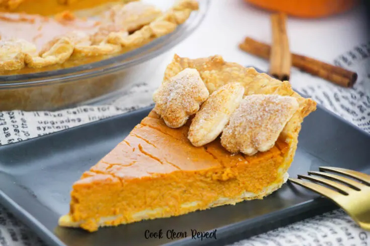 Featured image showing the finished baked pumpkin pie, a slice on a plate ready to eat.