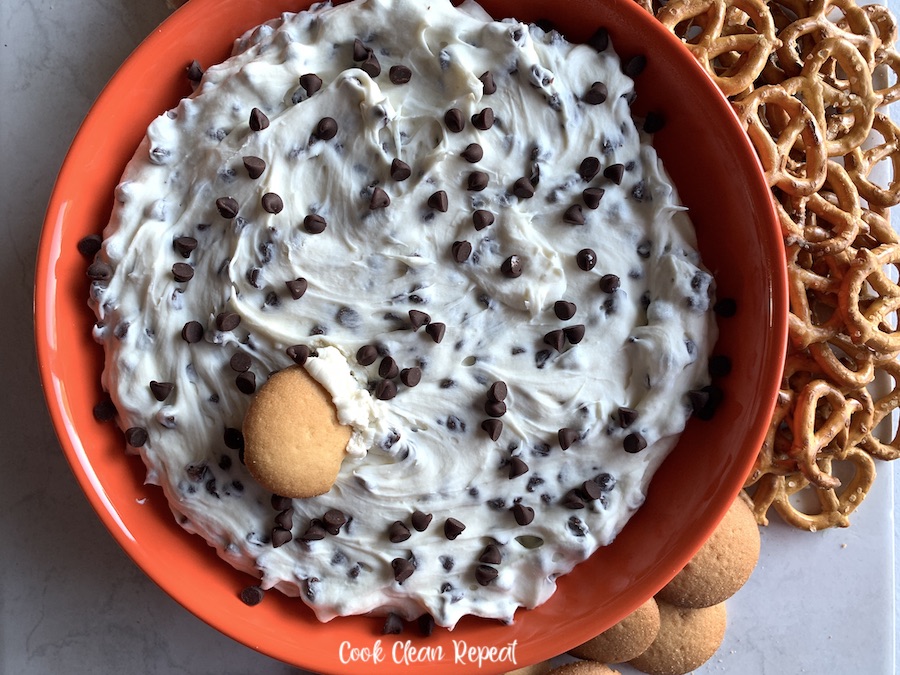 cannoli dip recipe ready to eat with crackers and pretzels.