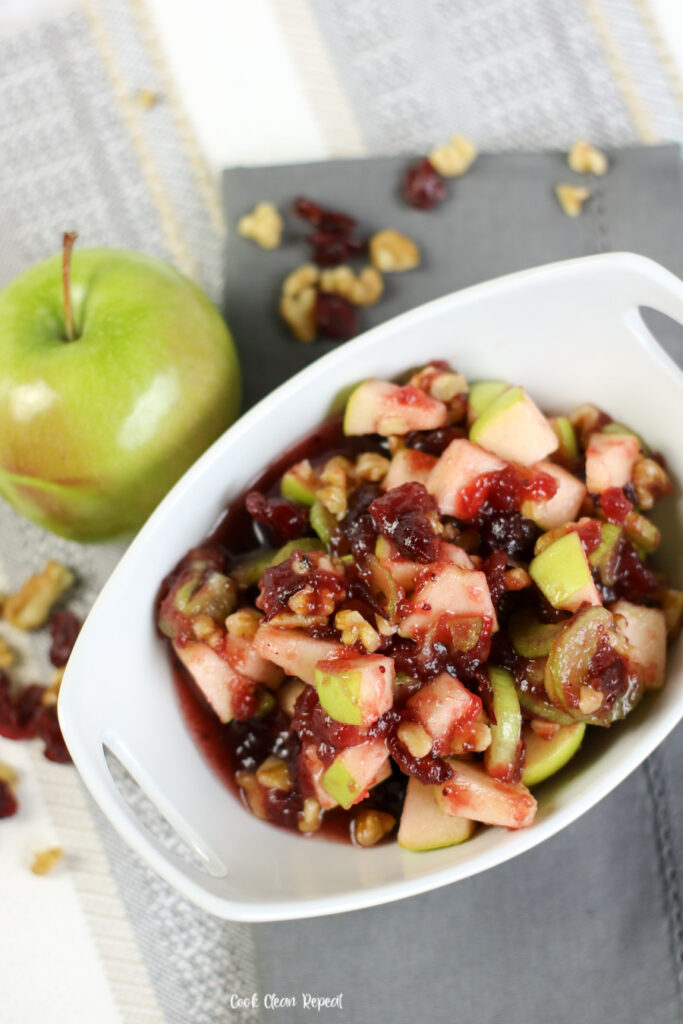 A delicious apple salad with cranberry and walnut ready to serve. 