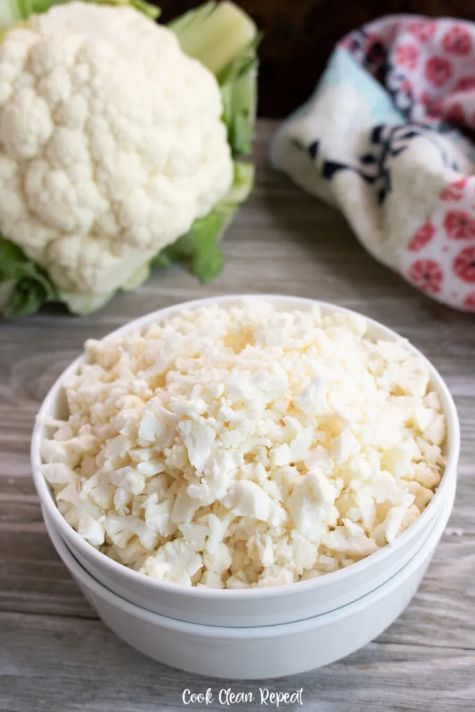 A bowl full of finished riced cauliflower ready to cook or store. 