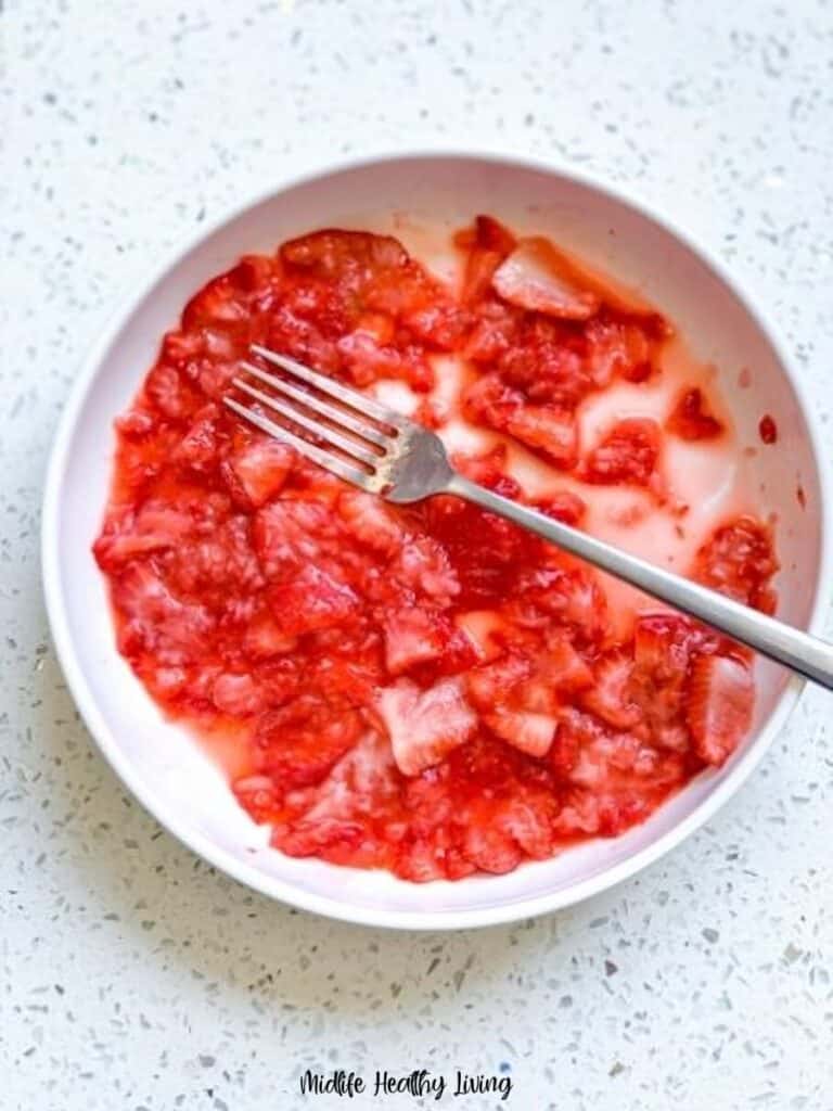 Crushed strawberries ready to be used for the recipe.