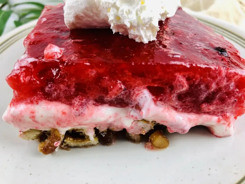 A close up view of the strawberry pretzel dessert ready to eat. 