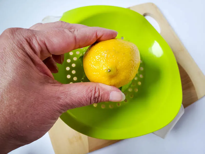 Lemons being juiced. 