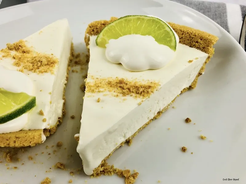 A close up look at two slices of the finished easy no bake key lime pie recipe. 