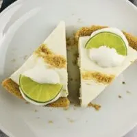 Featured image showing two slices of the finished easy no bake key lime pie.
