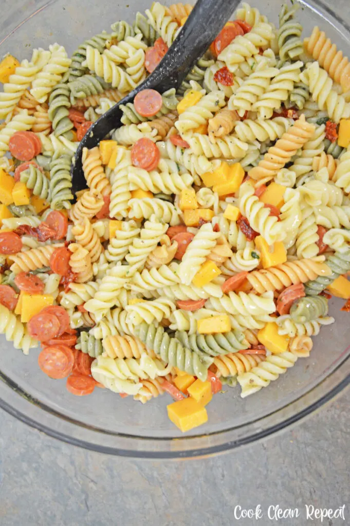 Italian pasta salad with pepperoni ready to be mixed and chilled. 
