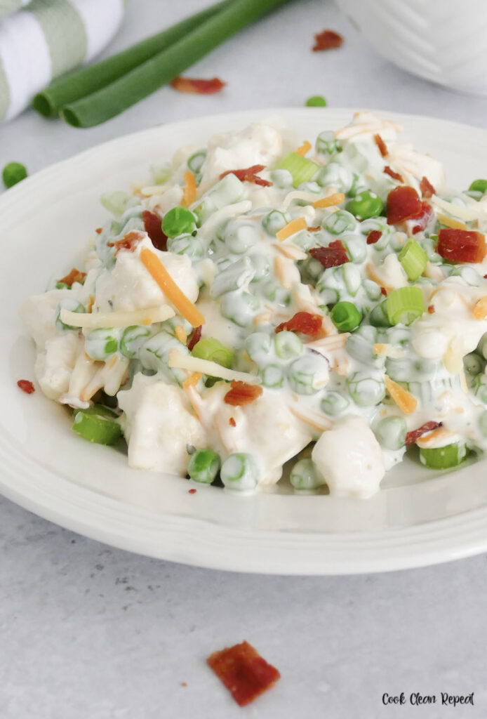 A close up look at the finished pea salad with ranch dressing. 