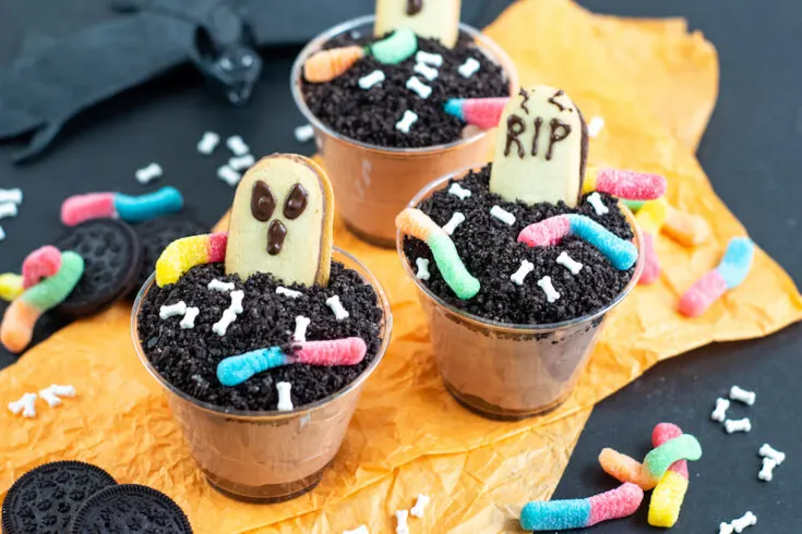 Featured image showing the finished Halloween dirt pudding dessert cups ready to eat.