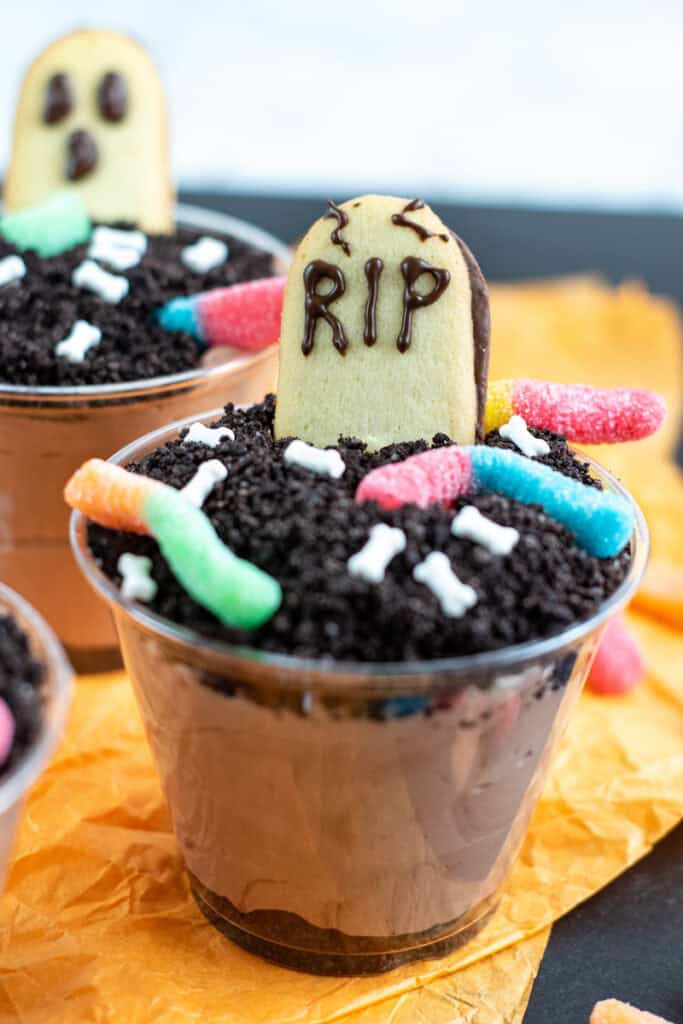 Close up of the finished halloween dirt pudding dessert cups ready to serve. 