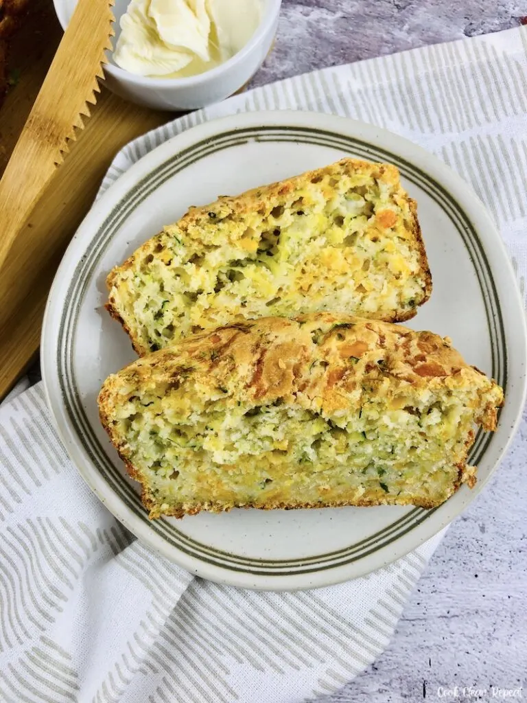 Two pieces of zucchini bread with cheese ready to eat. 