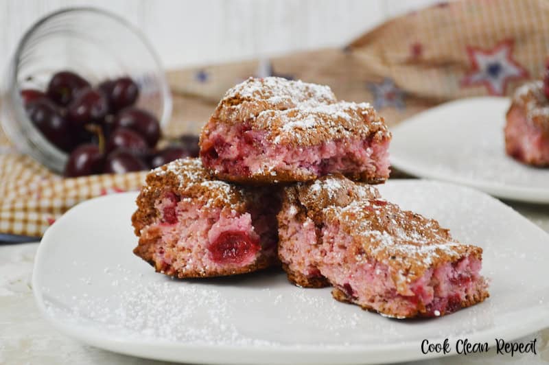 A plate with a stack of cherry bars ready to eat.
