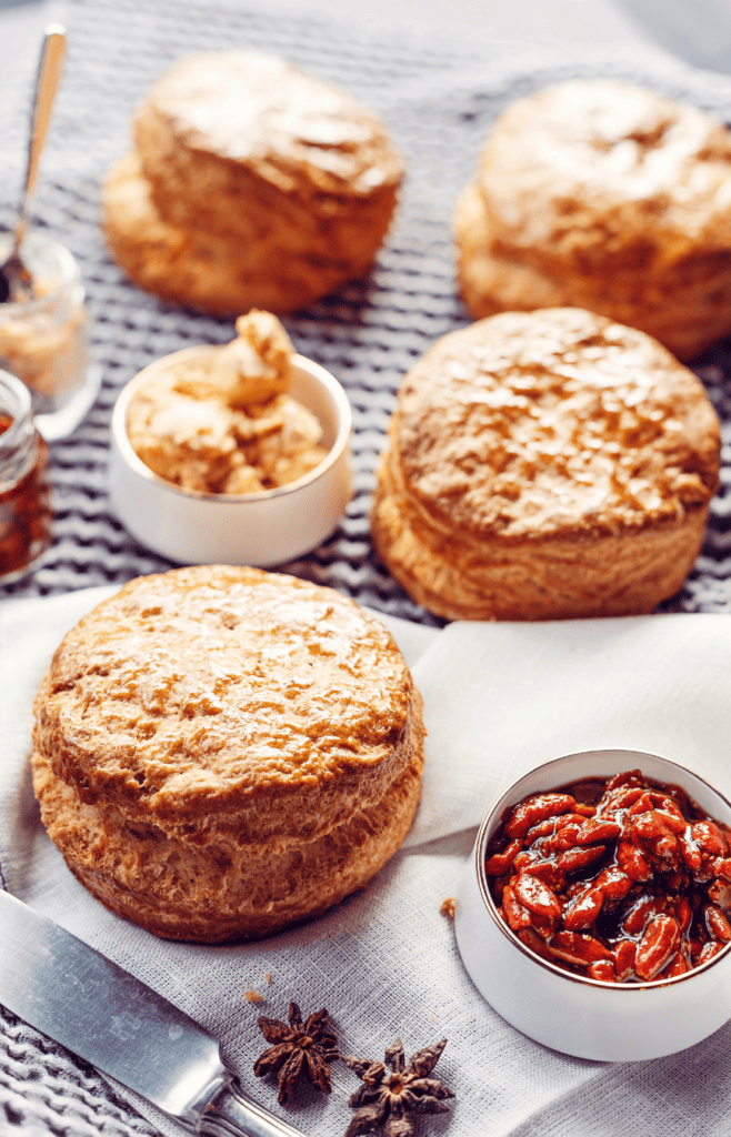 scones on a baking mat served with jelly and butter