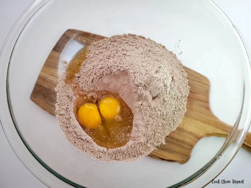 cake mix and eggs in a mixing bowl. 