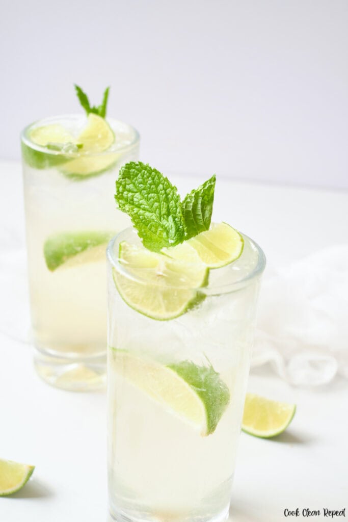 Two glasses of finished mint lime sparkling water ready to be enjoyed.