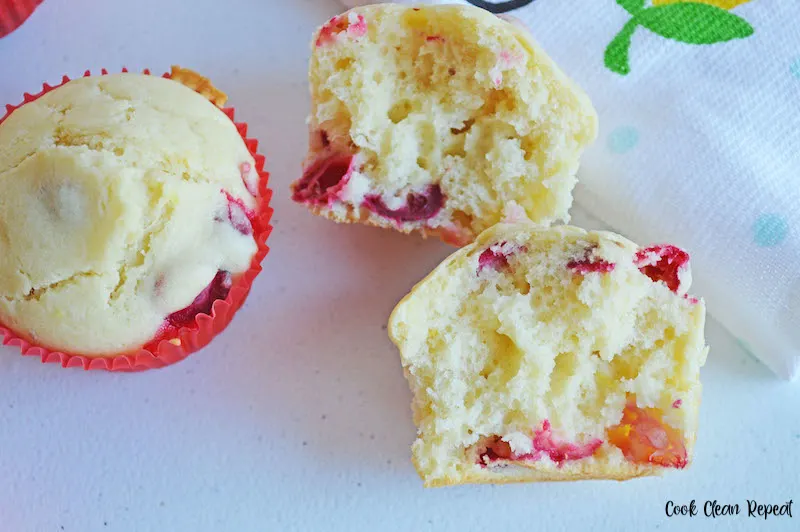 one of the finished cranberry lemon muffins split in half to show insides