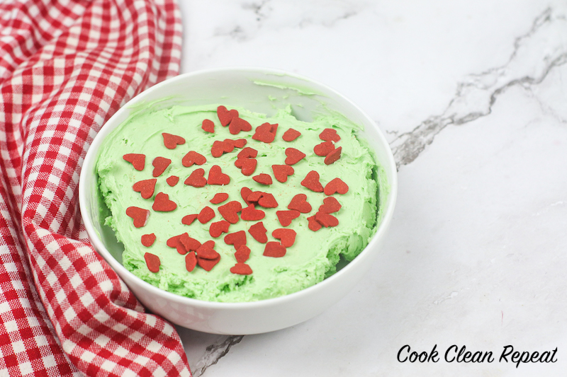 a bowl full of the finished grinch dip