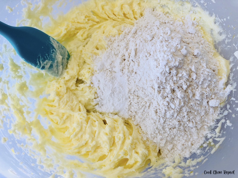 dry ingredients being added to the sugar and butter mixture. 