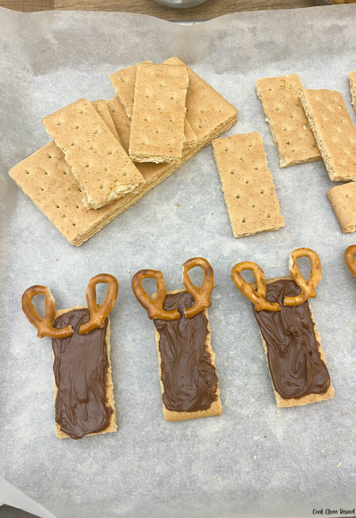 antlers being added to each graham cracker