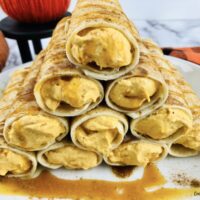 Featured image showing the finished no bake pumpkin cream cheese dessert roll ups ready to eat
