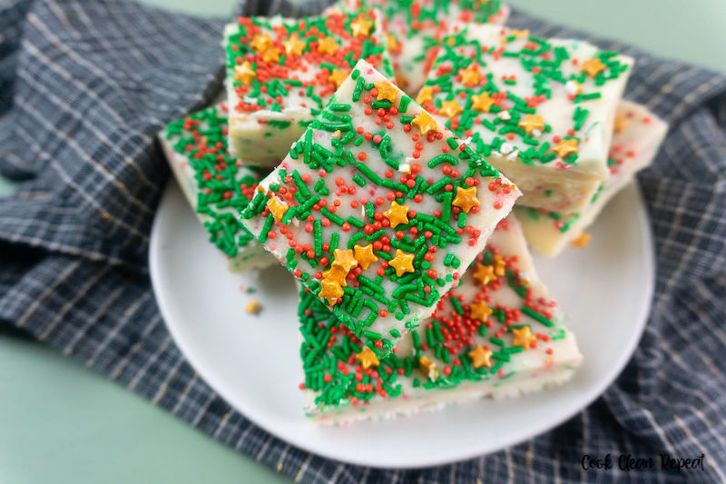 a plate full of pieces of the finished and set sugar cookie fudge recipe. 