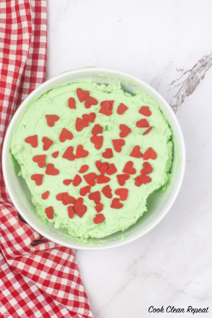Finished look at the grinch dip with hearts on top ready to eat