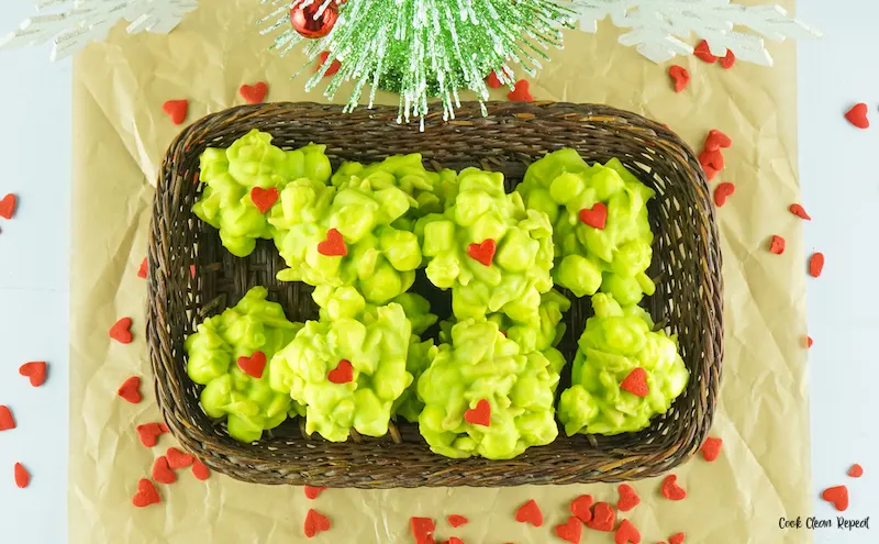grinch clusters with holiday decor in the background. 